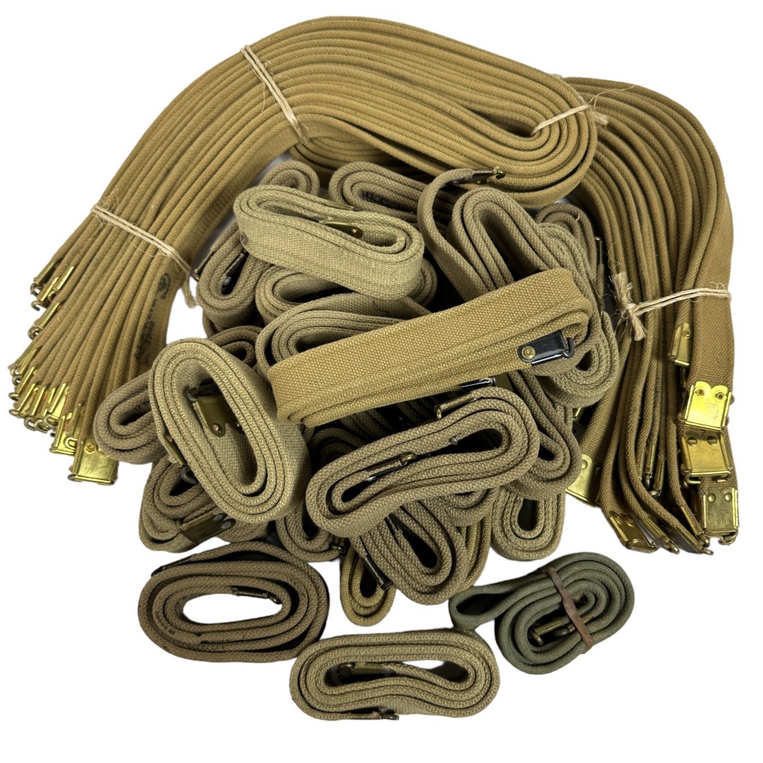 ~49 Vintage 1940's to 1960's British Surplus Belts: Lot of approximately 49 vintage 1940â€™s to 1960â€™s British surplus belts. Markings and vintages differ. Bundles appear to be WWII vintage while loose pieces appear to be 1960's vintage.