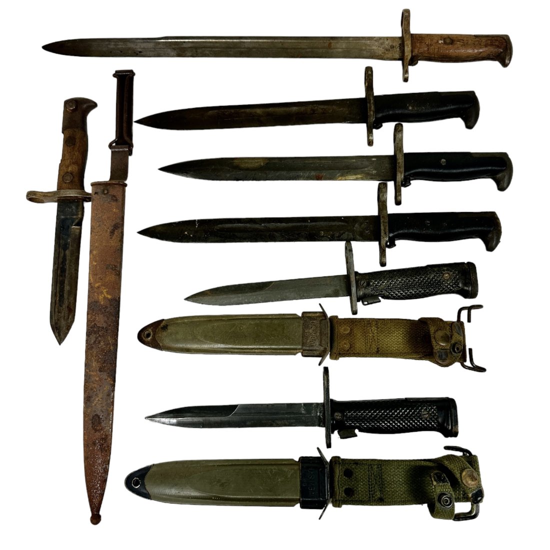 7 US Bayonet Lot M1 Garand M6 SA 1908: Lot of 7 US bayonets. 3 WWII MI Garand, 2 M6, SA 1908. One with shortened blade. 3 with scabbards. Condition varies, some rust throughout. A few appear unissued with greasy blades.