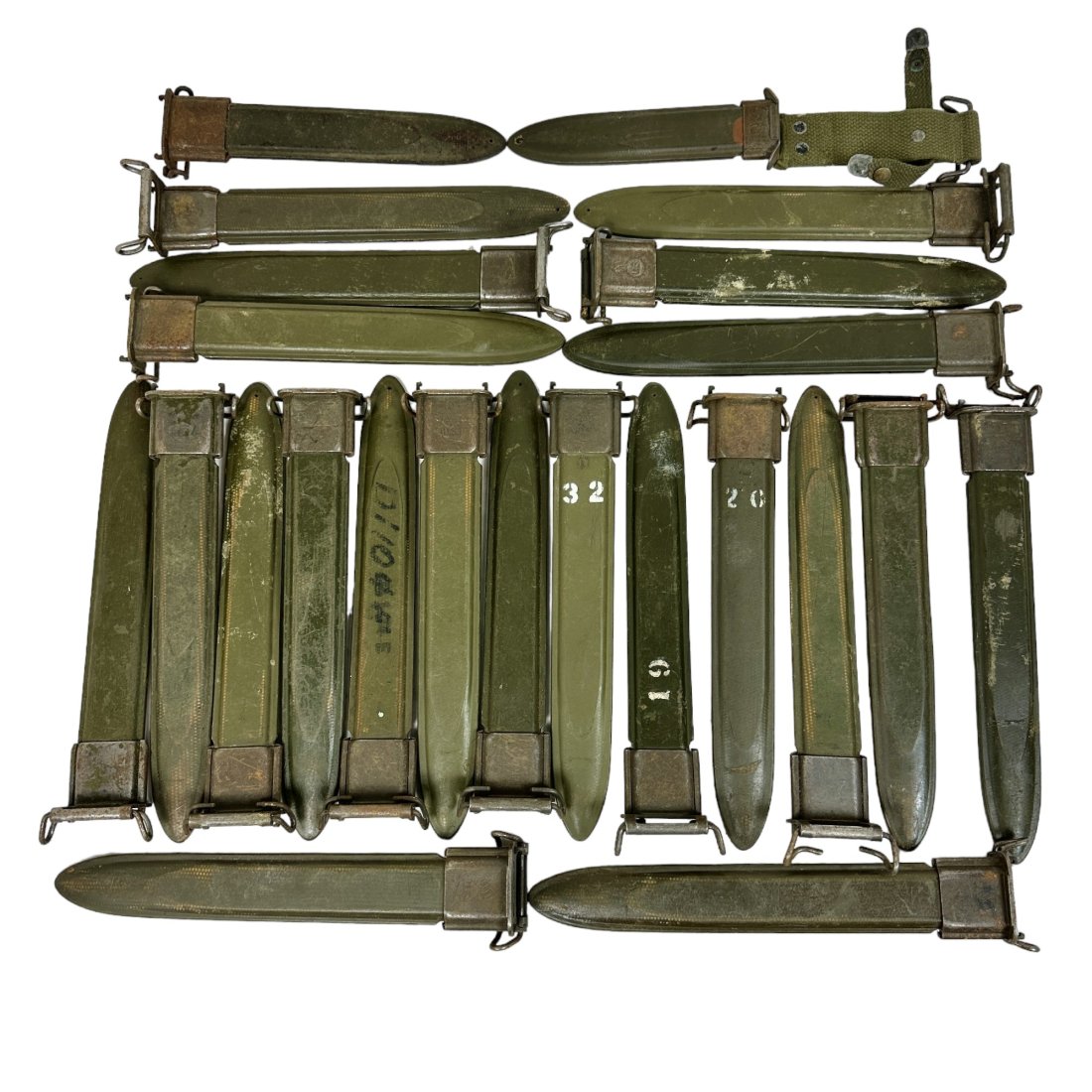 23 Used Vintage US Bayonet Scabbard Lot: Lot of 23 used vintage US bayonet scabbards. Top 2 are shorter. Some light rust throughout.