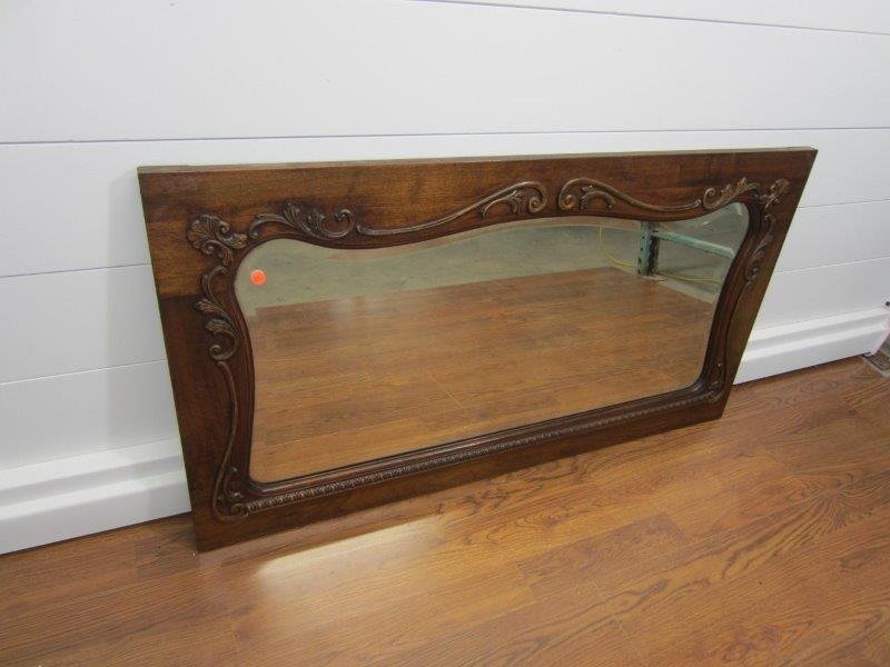 ANTIQUE LARGE BEVELED GLASS MIRROR W/SCROLLING DETAILS: 47" X 25" X 1". SOME DISCOLORATION TO THE MERCURY BACKING TO THE MIRROR. This item is only available for PICK-UP or DELIVERY by staff of The Antique Collective or private courier delivery as selected 