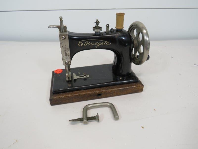 ELDREDGETTE CHILDS SEWING MACHINE: 8" L This item is available for shipping. It is the bidder's responsibility to take shipping costs into consideration when bidding. We charge the actual cost of your label plus a $10 handling fe