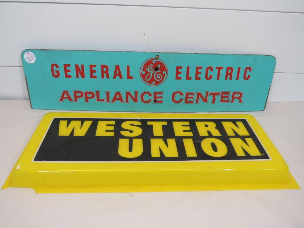 GE & Western Union Signs: General Electric Appliance Center is double sided masonite and measures 7" H x 29" L Western Union is a plastic raised sign measuring 9 3/4" H x 25" L x 2" Depth with damage to two corners as se