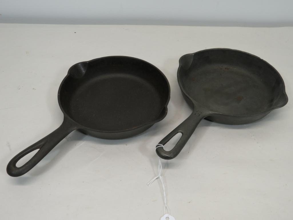 Pair of Logo Griswold Erie No. 3 Skillets: Lot of two cast iron skillets. One large logo, one small.