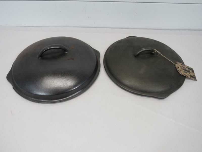 Pair of Cast Iron Dutch Oven / Skillet Lids: Tagged lid will fit a 10 1/4" skillet. Unmarked lid will fit a 10 1/2" skillet. 