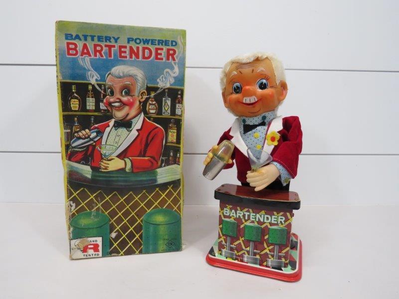 Mid Century T.N. Co Battery Operated Bartender Novelty: 1950s T.N. Co - Japan. Battery operated bartender in original box. Martini glass is broken and has been glued. The bartender does show age, but is in very fine condition. Untested. Original box is ver