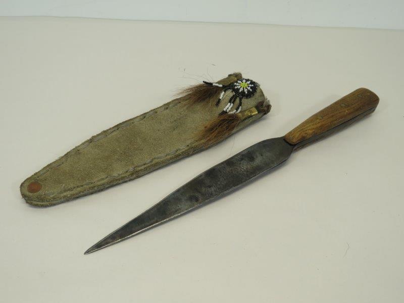 Native American Handmade Sheathed Knife: Knife appears to have been hand-forged. Hand beadwork on sheathe, with some wear to the sheathe edges as shown in photos. 13 1/2" L 