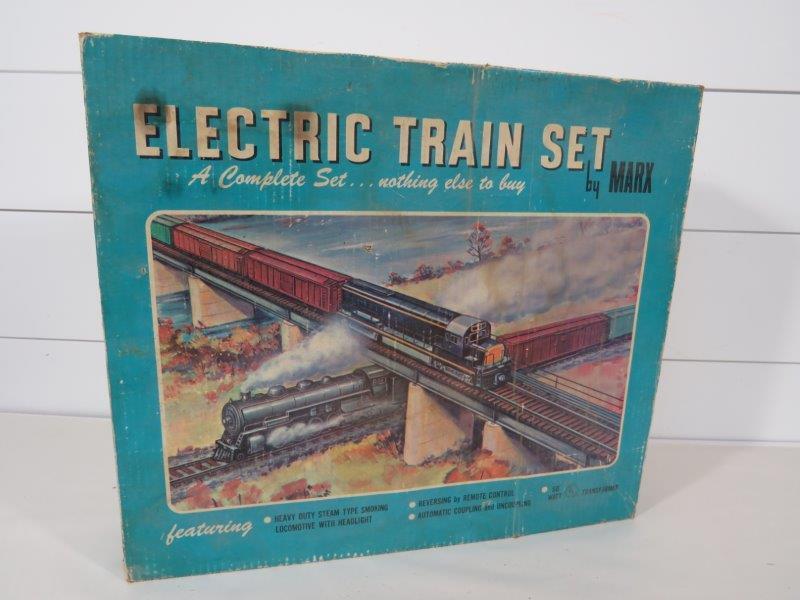 Marx 50875 Electric Train Set: Complete and in original packaging. Product is untested. Includes: Heavy Duty Steam Type Smoking Locomotive with Headlight, Switcher Tender, 3 Freight Cars, Caboose, 10 Sections of Track Making 102" O