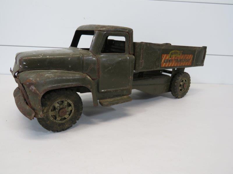 Buddy L Army Transport Truck: Truck does show rusting as well as denting due to wear and age. Tires are all fully intact. 7" H x 19 1/4" L 