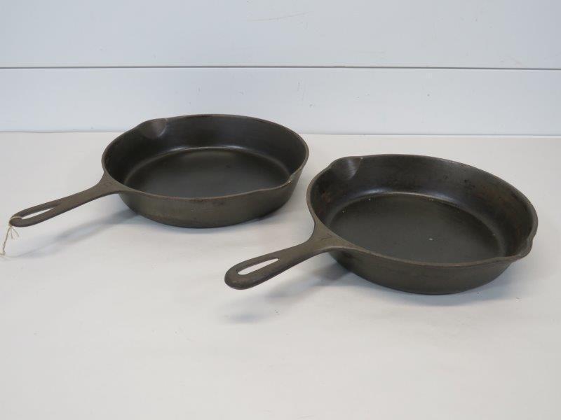 Griswold Large & Small Logo No. 7 & 8 Cast Iron: Large Logo marked: Erie PA, USA 704 M. Skillet is very nice and clean, but has a very slight wobble to it. Small Logo skillet has a small amount of pitting beginning and sits flush. Small 