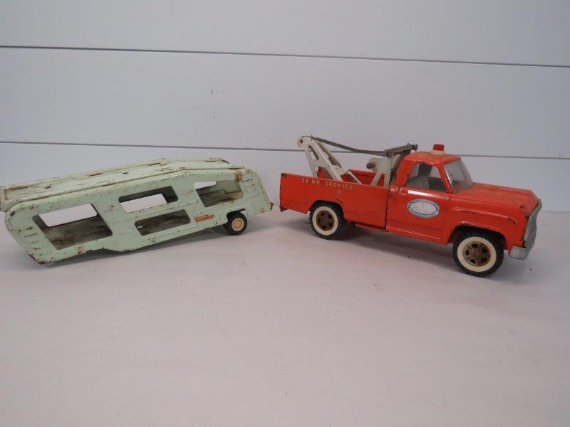 Tonka Wrecker Truck & Car Hauler: Both showing scratches and paint loss as well as rusting due to age and wear. Wrecker - 6" H x 14" L Hauler - 4 1/2" H x 14" L 