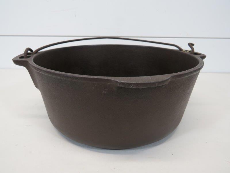 Griswold Small Logo Wagner Ware 5 QT Cast Iron Pot: This bean pot is in good seasoned condition, as shown in photos. Does have a slight wobble to it. One nick out of rim as shown and no pitting. 4 1/4" H x 10 1/2" W 