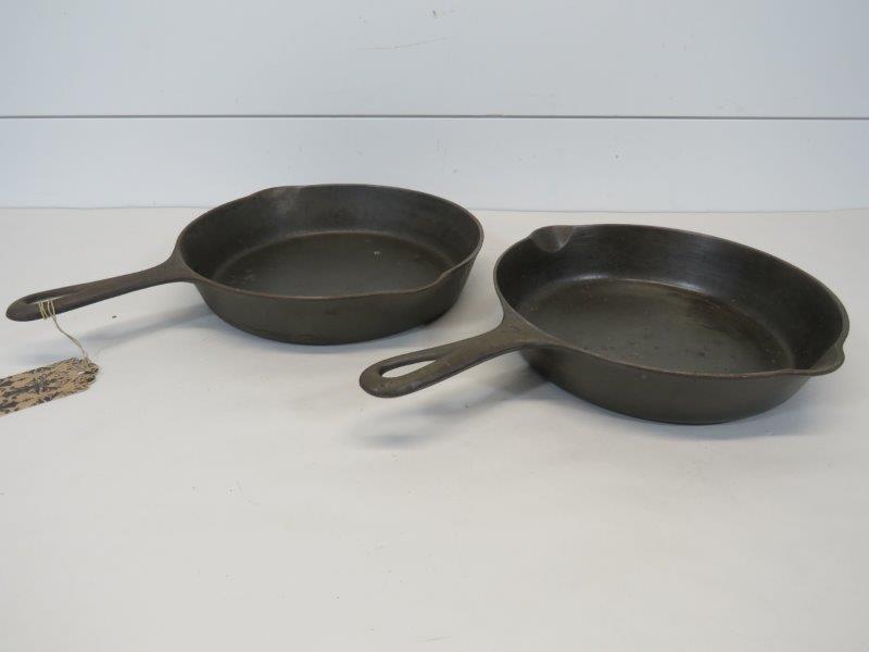 Griswold Large & Small Logo No. 7 & 8 Cast Iron: No. 7 Small Logo marked: Erie PA. 701G. Showing some pitting, but sits flush. No. 8 Large Logo marked: Erie PA, U.S.A. 704V. Showing very little pitting and sits flush. Small 