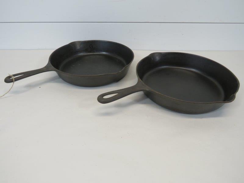 Griswold Large & Small Logo No. 8 Cast Iron Skillets: Small Logo No. 8 marked: Erie PA. 704J. It is very clean and sits flush. Large Logo No. 8 marked: Erie PA, U.S.A. 704S. It shows very little pitting beginning and sits flush. Small Logo - 10 1/2