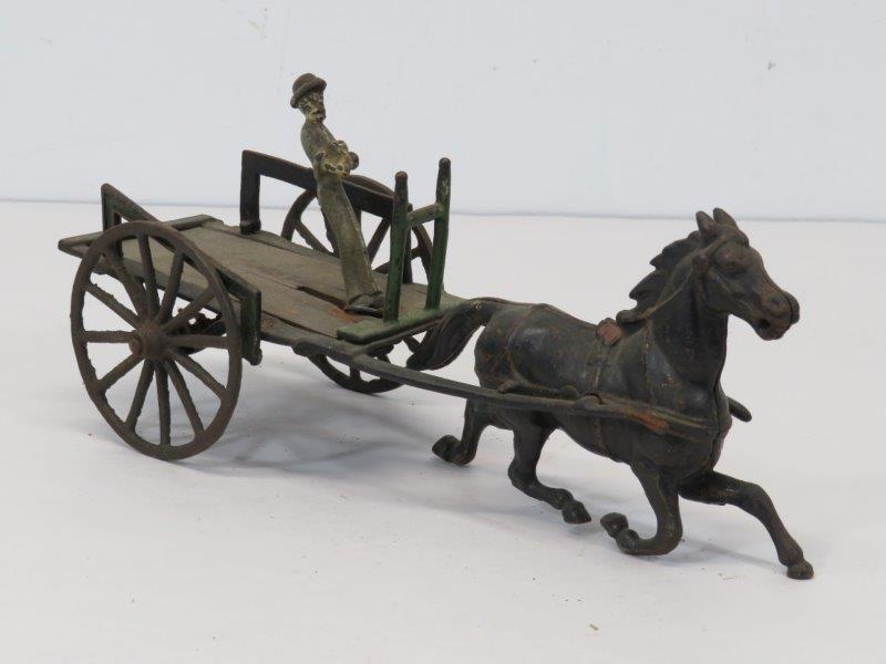 Antique Cast Iron Standing Driver Horse and Wagon Toy: Original cast iron toy. With some paint loss and condition issues, as noted in photos, appropriate for age and play. 10 1/4" L 