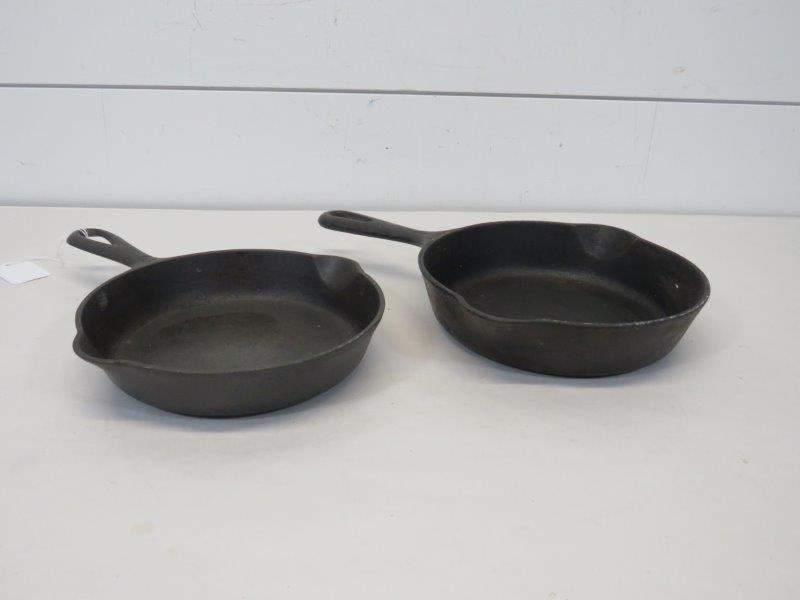 Griswold Small Logo No. 4 & Large Logo No. 3 Cast Iron: Both sit flat. Large Logo # 3 - 709B- 6 1/2" D Small Logo # 4 - 702 - 7" D 