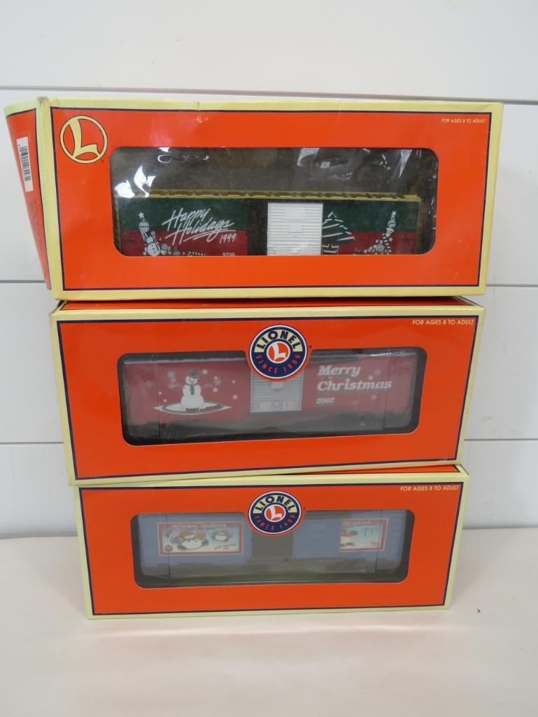 Lionel O Gauge Christmas Collector Box Cars (3): All with original packaging with damage to some of the boxes as shown in photos. 6-36243 6-36253 6-282243 Approx. 10" L 