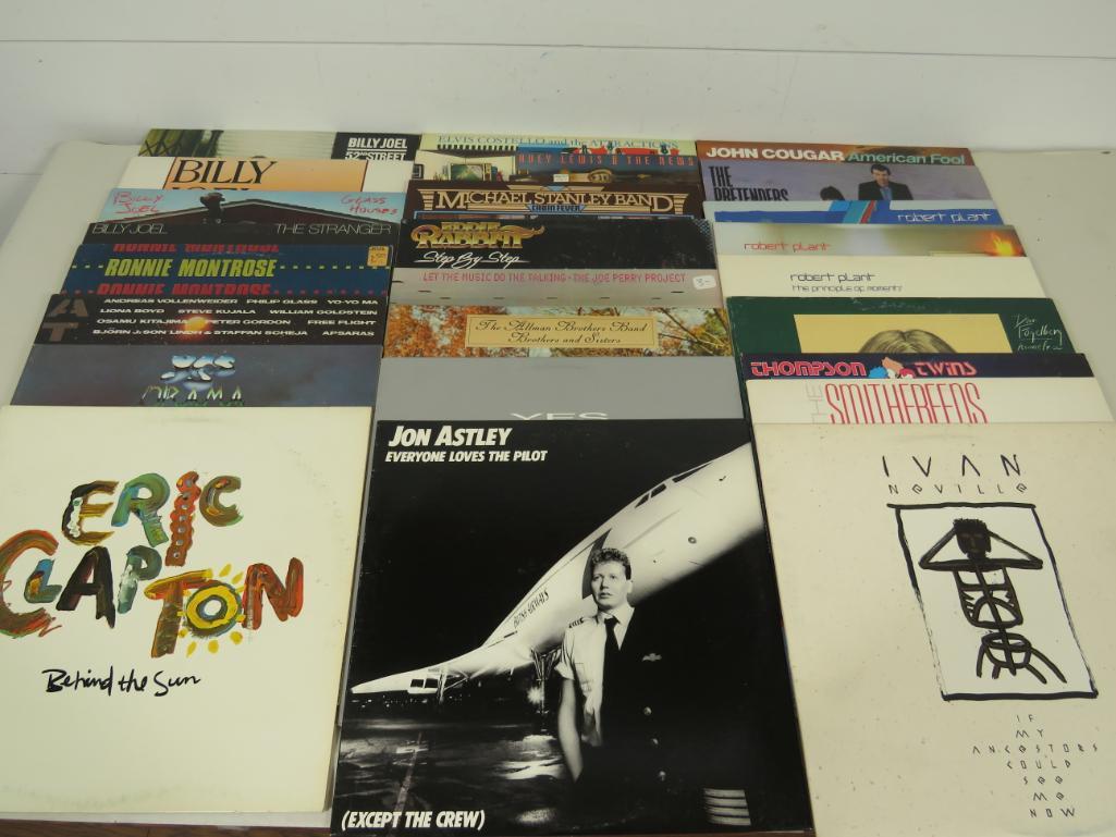 Large Lot of Vintage Vinyl Albums (25): All albums play well, are free of any chips, cracks or breaks and are all in original sleeves. Artists included are - Billy Joel Ronnie Montrose Atmospheres Elvis Costello Huey Lewis Michael Stanley
