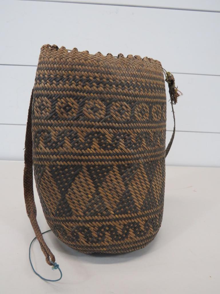 Early Indonesian Rattan Backpack: This item is shippable. We offer combined shipping in-house. Dimensions: 10" H x 7" W Photos will serve to represent any other condition issues. Condition reports will be answered up until 24 