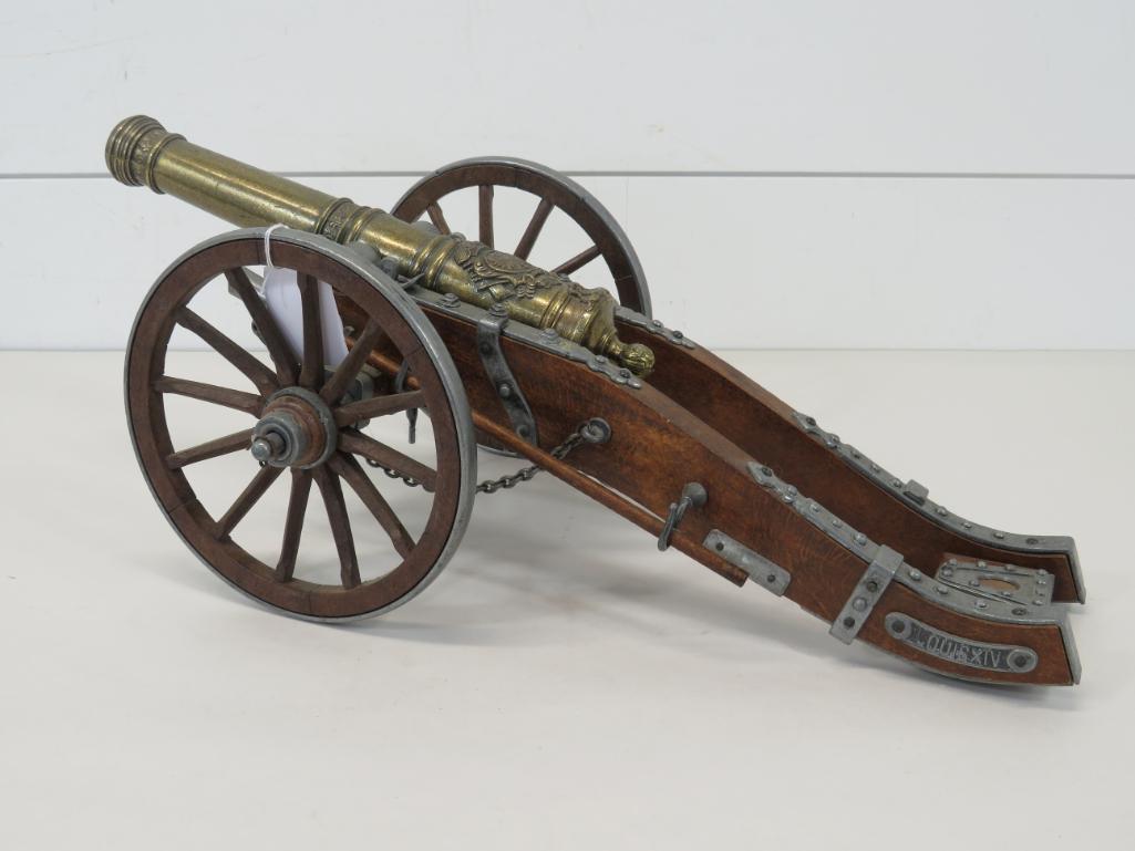 Louis XIV Model Cannon: This item is shippable. We offer combined shipping in-house. Dimensions: 6 3/4" H x 17 1/2" L x 7 1/2" W Highly detailed with mounts, chains, and details. Cannon and fittings are all from