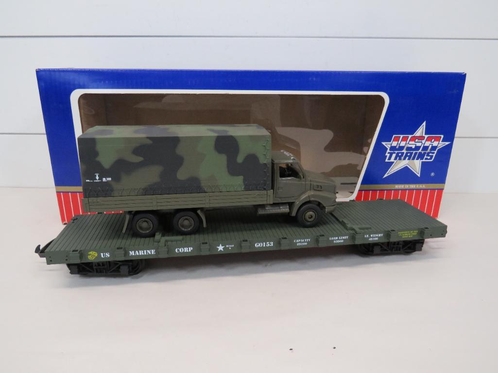 USA Trains #R1760 US Marine Corp. Flat Car w/Truck: This item is shippable. We offer combined shipping in-house. Dimensions: G Scale This train car looks to be new. Photos will serve to represent any other condition issues. Condition reports will b