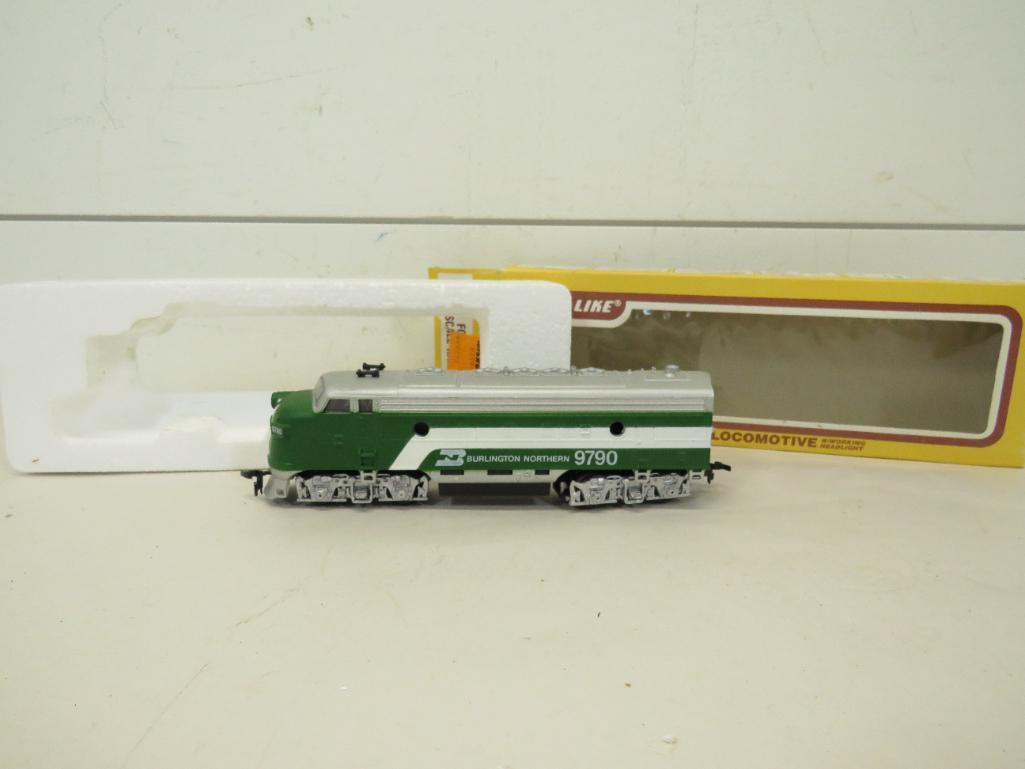 Life-Like Ho Scale Diesel Locomotive: This item is shippable. We offer combined shipping in-house. Dimensions: 6 1/2" Runs good forward and reverse. Operating headlight. Photos will serve to represent any other condition issues. Condi