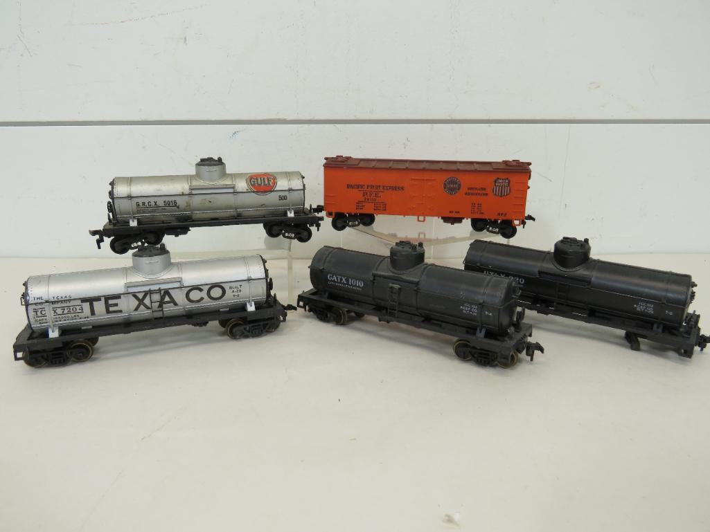 Varney HO Scale Freight Cars (5): This item is shippable. We offer combined shipping in-house. Dimensions: 5" size range. One tanker is missing a set of wheels. Photos will serve to represent any other condition issues. Condition 
