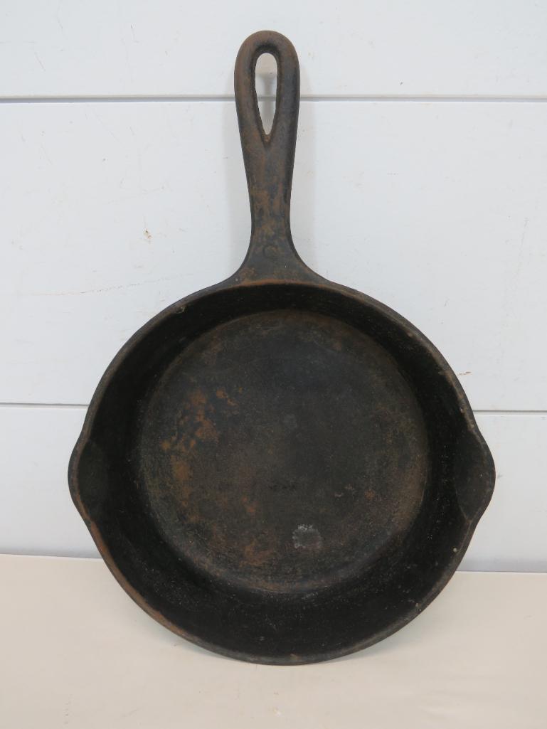 Wagner Ware 1055 Cast Iron Skillet No.5: This item is shippable. We offer combined shipping in-house. Dimensions: 8" It does have some surface rust in the bottom. Sits flat. Photos will serve to represent any other condition issues. Cond