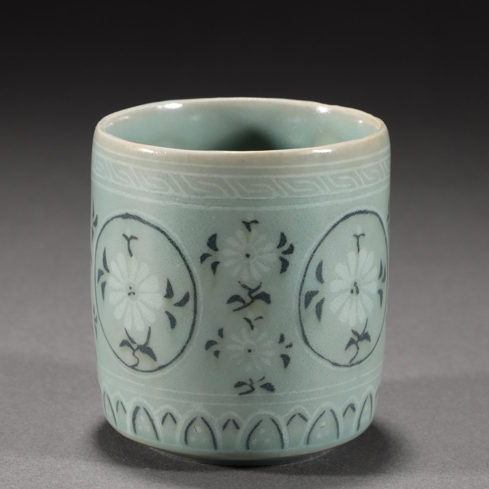 A Korean Celadon Glazed Cup: A Korean Celadon Glazed Cup. H 8cm; W 7.2cm