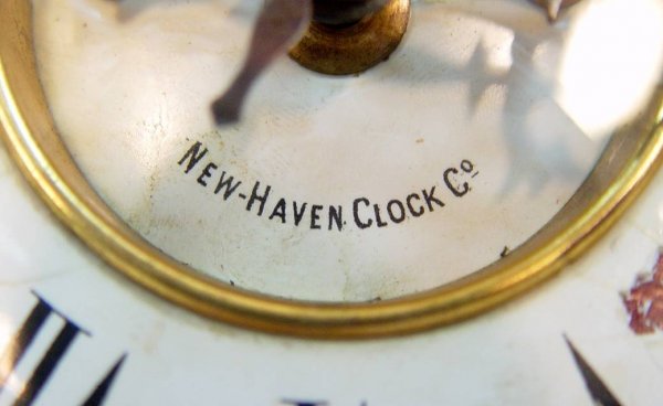 NEW HAVEN CAST IRON MANTEL CLOCK WITH SCENES OF STA - 2