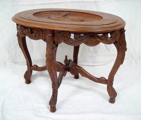 COFFEE TABLE WITH CARVED SCENE OF MOTHER & CHILD ON
