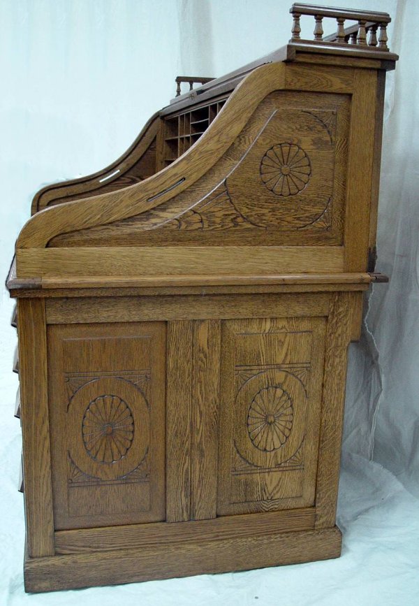 CARVED OAK S ROLL TOP DESK WITH CARVED RAISED PANE - 4