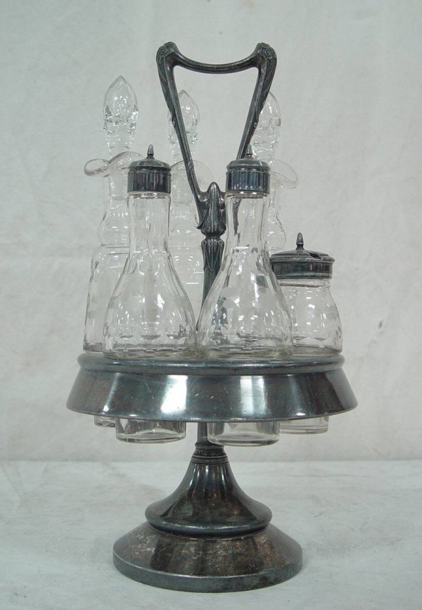 SIX PIECE ETCHED GLASS CASTER SET IN SILVER PLATE