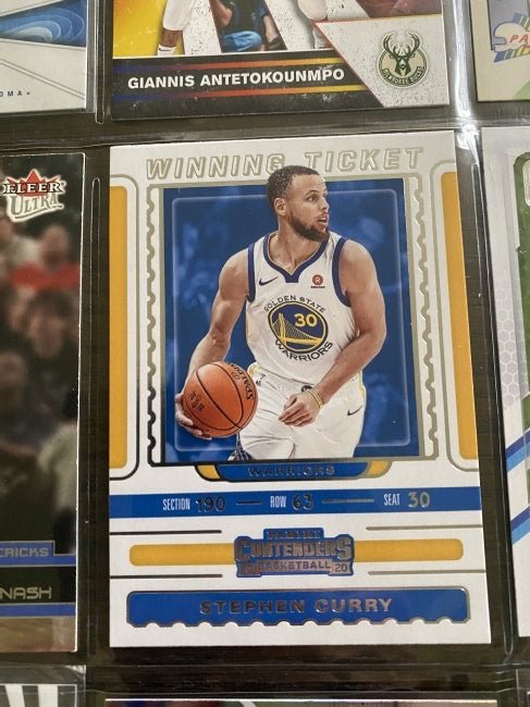Stephen Curry and box full of cards: Stephen Curry and box full of cards. This comes from a state sale and each box was divided in different lots.