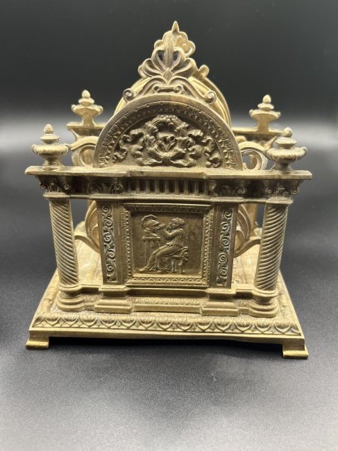 Antique Bronze Napkin Holder: Antique Bronze Napkin Holder women sculpturing soldiers head on one side and a women bored at her desk on the other side. 5 inches tall and 6 inches wide