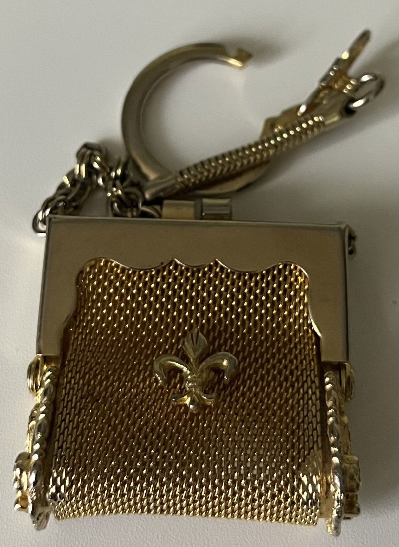 Earring Silver And Gold played purse: 2 earring silver pieces 925 and a gold plated small purse keychain