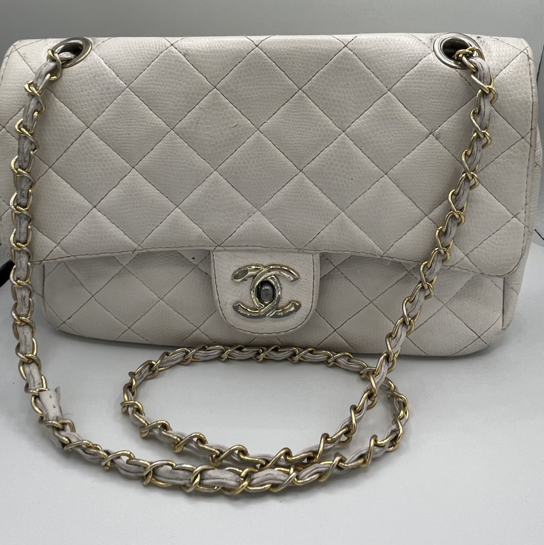 Channel Purse: Channel Medium Size Purse white color . Size: 11 x 8 inches . Pre owned purse, No COA came with it, selling As Is. If you need more pictures please send us a message.