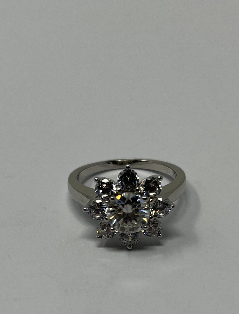 Moissanite Silver Ring: Moissanite Silver Ring , the stones test positive for Diamond with Diamond selector 2 tester . It is a Moissanite stone . Size: 6