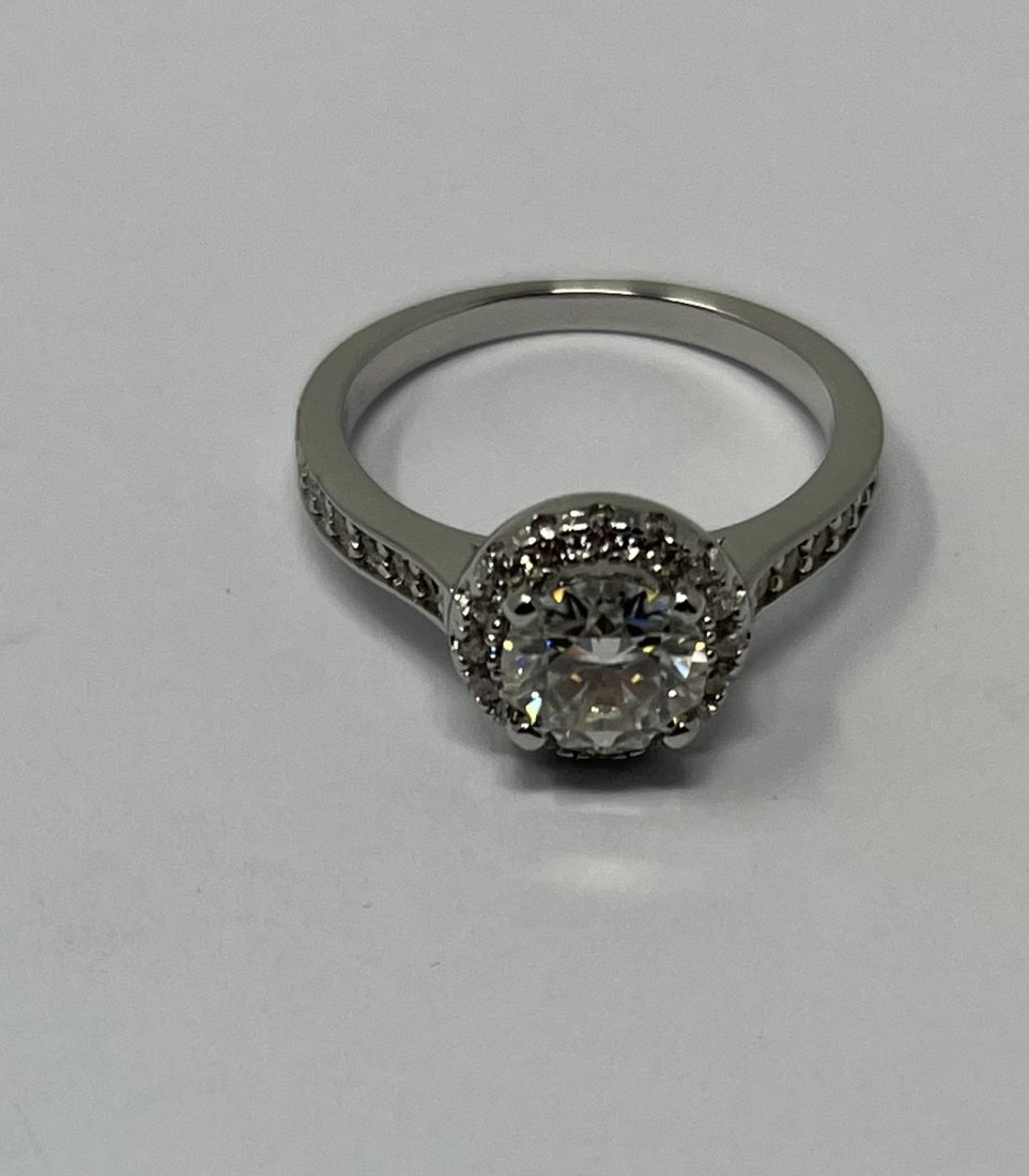 Moissanite Ring: Moissanite Silver Ring , the stones test positive for Diamond with Diamond selector 2 tester . It is a Moissanite stone . Size: 6