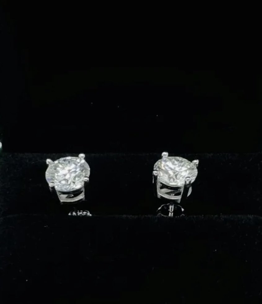 2 Carats Sparkling Moissanite Earrings: 18k Yellow Gold Plated on sterling silver Moissanite VVS1, Color Grade D , Weight: 4 Carats total . It comes with GRA Certificate. stone passes for Diamond Using a Diamond Tester .