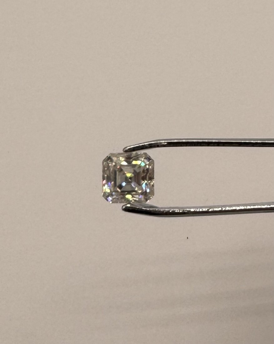Asscher Moissanite Stone: Asscher Moissanite Stone. Weight: 2 carats. Color D . Stone comes with certificate of authenticity GRA. Stone passes for diamond using a diamond tester .