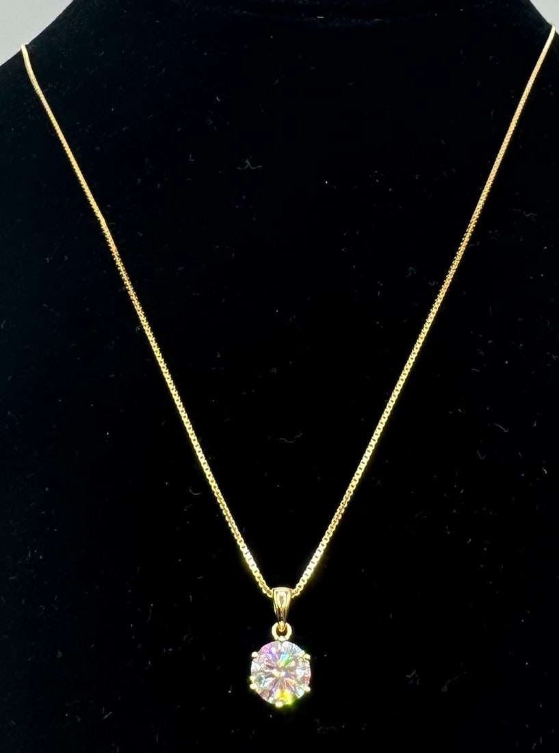 Moissanite Neckalce: (18k yellow gold plated on sterling silver. Stone: moissanite VVS1 Color: D . Stone weight: 2 carats. Stone comes with certificate of authenticity GRA. Stone passes for diamond using diamond tester.