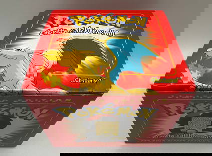 Sealed 1999 Charizard Pokemon Ball: Sealed 1999 Nintendo Charizard Pokemon Ball gold plated trading card . The Pokemon ball is sealed .