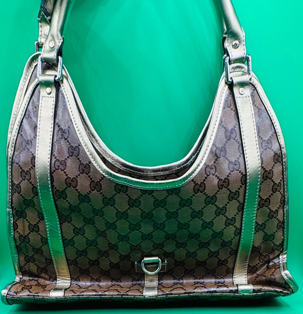Gucci Handbag: Authentic Pre Owned Gucci Crystal Monigram Handbag . Pictures are from the actual item offered in our auction.