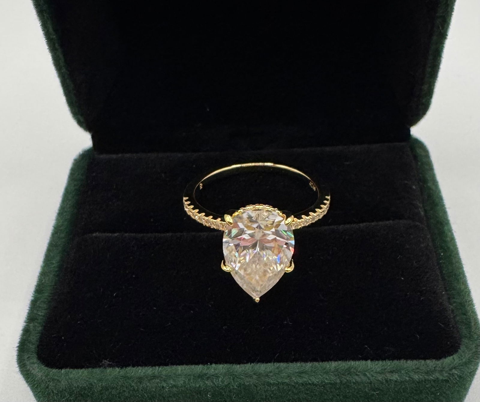 Pear Cut 5 Carats VVS Ring: 18k Yellow Gold Plated On sterling Silver Moissanite VVS1 Stone Ring Color: D Stone Size: 5 carats. 