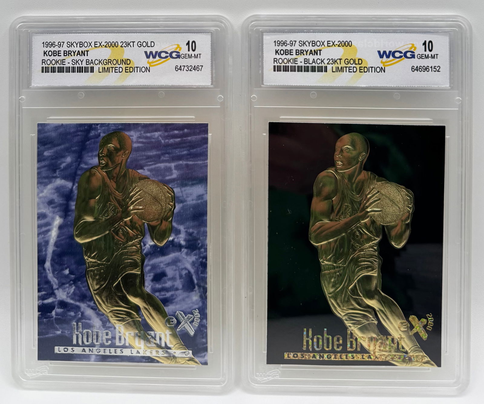 (2) 1996-97 Skybox EX-2000 Kobe Bryant Rookie 23KT Gold Cards - WCG 10: Player: Kobe Bryant • Set: 1996-97 Skybox EX-2000 (23KT Gold Sculpted) • Variations: Sky Background and Black Background Limited Editions. • Grading: Both graded WCG 10 Gem-MT •