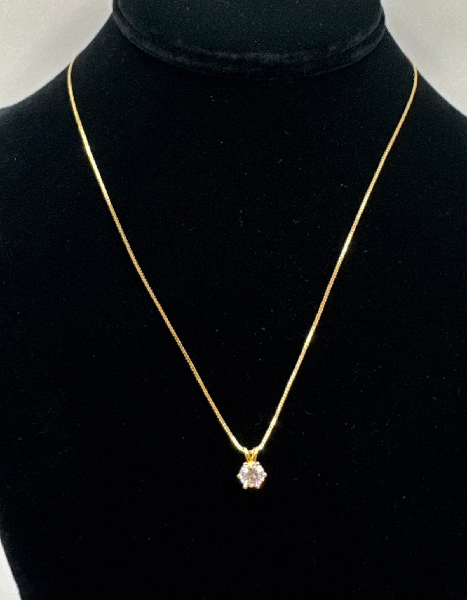 1.00 CT Round Brilliant Moissanite Solitaire Necklace - 18K Yellow Gold Plated: Genuine 1.00 Carat Round Brilliant Cut Moissanite. • Metal: 18K Yellow Gold Plated over Solid .925 Sterling Silver. • Design: Timeless 6-prong solitaire pendant on a delicate gold-tone