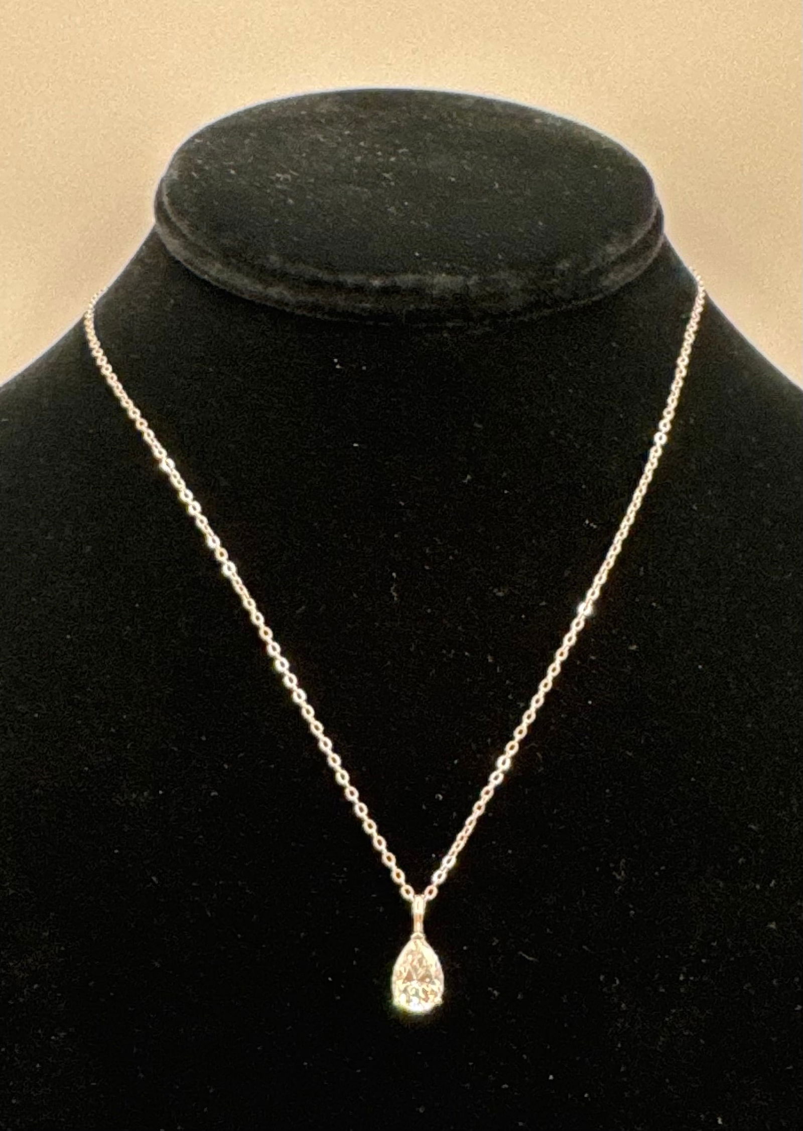 2 Carat Brilliant Pear Moissanite Necklace | Sterling Silver | Diamond Tester Positive: Capture the light with this elegant 2.00 Carat Pear Shape Moissanite pendant. Known for its graceful "teardrop" silhouette, the pear cut combines the brilliance of a round diamond with the unique