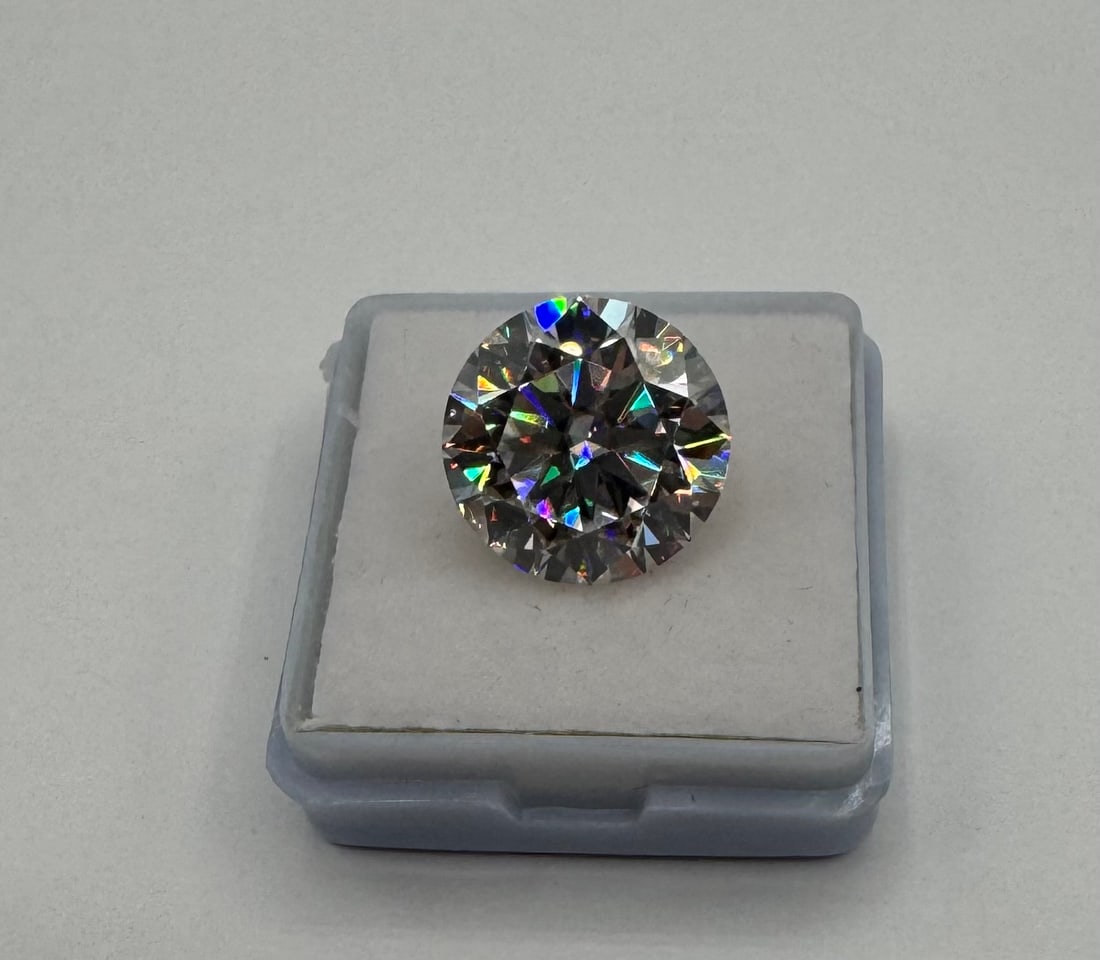 10 Carat Round Moissanite Loose Stone | Elite Fire & Clarity | Diamond Tester Positive: Experience unparalleled luxury with this colossal 10.00 Carat Round Brilliant Cut Moissanite. A stone of this magnitude is rarely seen and offers a breathtaking display of fire and brilliance.