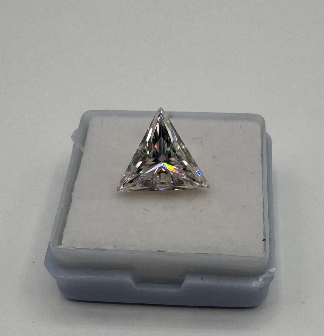 5.00 CT Lab-Created Triangle Cut Moissanite - GRA Certified - D/VVS1: Gemstone Type: Lab-created Moissanite • Carat Weight: 5.00 Carats • Cut/Shape: Trillion (Trilliant) Brilliant Cut • Color Grade: D (Colorless) • Clarity Grade: VVS1 (Eye