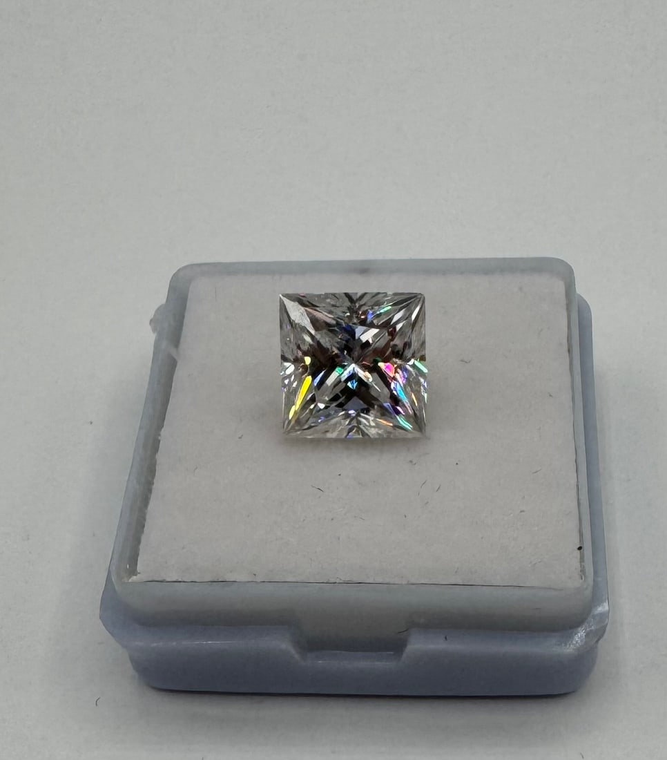 4.00 CT Princess Cut Moissanite - VVS1 D Color - GRA Certified: Offered for auction is a magnificent 4.00 Carat Princess Cut Moissanite. This lab-grown gemstone features a square silhouette with sharp, uncut corners and a brilliant faceting pattern designed to